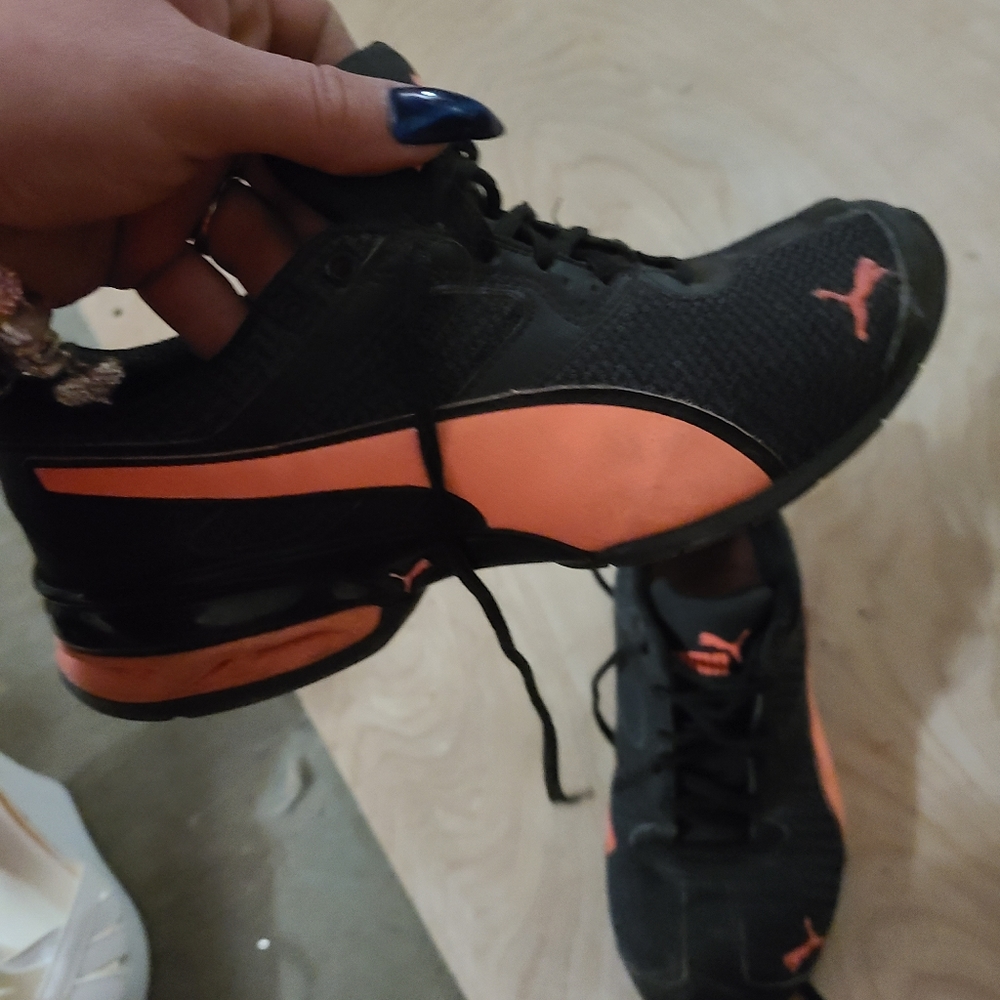 Peach and black pumas